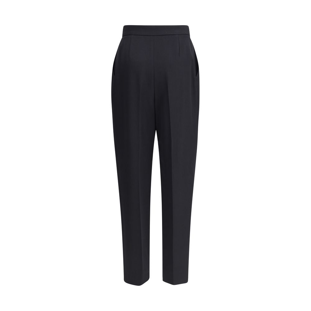Black Wool Dress PantsBalmain’s grain de poudre tailored Pants express elegance and rigor with an impeccable cut. Featuring a sash at the waist, they feature a concealed zipper and hook-and-eye closure under the flap and ironed pleats at the front, which