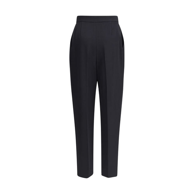 Black Wool Dress PantsBalmain’s grain de poudre tailored Pants express elegance and rigor with an impeccable cut. Featuring a sash at the waist, they feature a concealed zipper and hook-and-eye closure under the flap and ironed pleats at the front, which