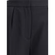 Black Wool Dress PantsBalmain’s grain de poudre tailored Pants express elegance and rigor with an impeccable cut. Featuring a sash at the waist, they feature a concealed zipper and hook-and-eye closure under the flap and ironed pleats at the front, which