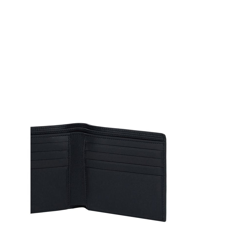Black Calf Leather Bos Taurus WalletBalenciaga’s Leather Wallet is an essential accessory with a strong character. Featuring a bill fold design, it features the iconic contrasting logo on the front, giving it a distinctive and contemporary touch. The inte