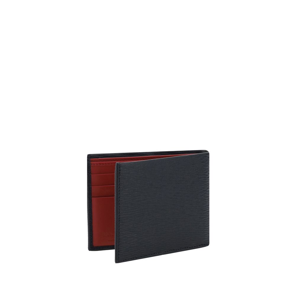 Black Calf Leather Bos Taurus WalletLeather Wallet by Ferragamo is an elegant accessory with a billfold design that is compact and refined. On the front it is embellished with a plaque bearing the iconic Gancini logo, the distinctive symbol of the maison.