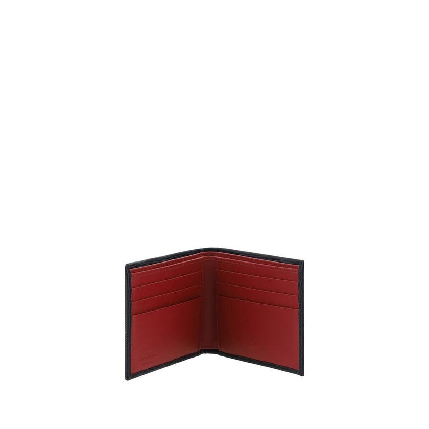 Black Calf Leather Bos Taurus WalletLeather Wallet by Ferragamo is an elegant accessory with a billfold design that is compact and refined. On the front it is embellished with a plaque bearing the iconic Gancini logo, the distinctive symbol of the maison.