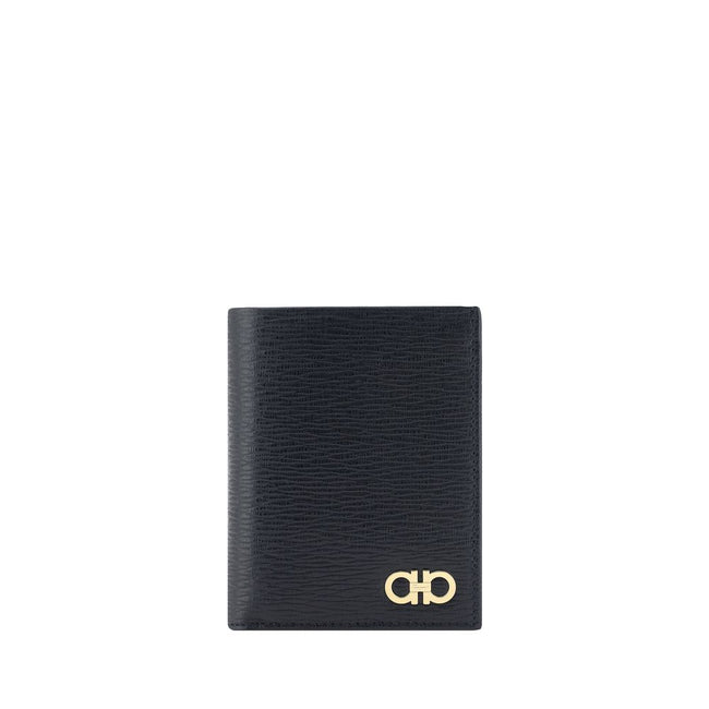 Black Calf Leather Bos Taurus WalletCalfskin Wallet by Ferragamo, billfold design, iconic Gancini logo plaque applied to front, interior card slot, bill compartment, coin pocket with flap for closure. Season: AW25 Dimension: 8x8x2 Composition: 100% Calf L
