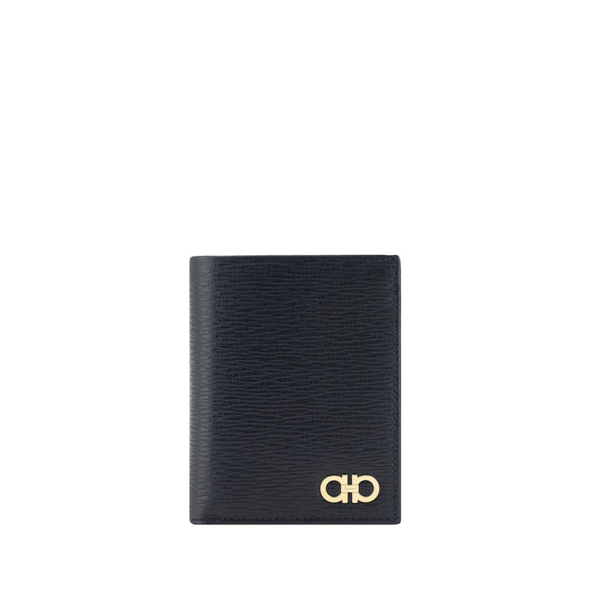 Black Calf Leather Bos Taurus WalletCalfskin Wallet by Ferragamo, billfold design, iconic Gancini logo plaque applied to front, interior card slot, bill compartment, coin pocket with flap for closure. Season: AW25 Dimension: 8x8x2 Composition: 100% Calf L