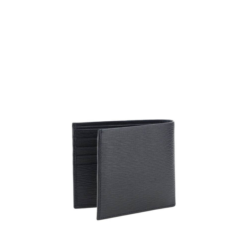 Black Calf Leather Bos Taurus WalletCalfskin Wallet by Ferragamo, billfold design, plaque with iconic Gancini logo applied on front, interior card slot, bill compartment. Season: AW25 Dimension: 11.5×11.5 Composition: 100% Calf Leather Bos Taurus MADE IN