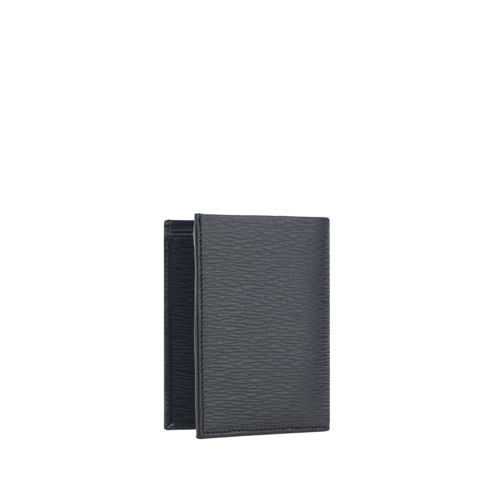 Black Calf Leather Bos Taurus WalletCalfskin Wallet by Ferragamo, billfold design, iconic Gancini logo plaque applied to front, interior card slot, bill compartment, coin pocket with flap for closure. Season: AW25 Dimension: 8x8x2 Composition: 100% Calf L