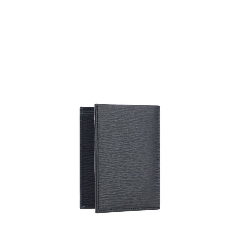 Black Calf Leather Bos Taurus WalletCalfskin Wallet by Ferragamo, billfold design, iconic Gancini logo plaque applied to front, interior card slot, bill compartment, coin pocket with flap for closure. Season: AW25 Dimension: 8x8x2 Composition: 100% Calf L
