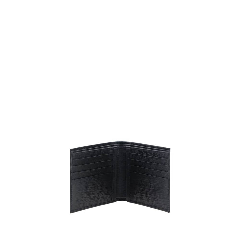 Black Calf Leather Bos Taurus WalletCalfskin Wallet by Ferragamo, billfold design, plaque with iconic Gancini logo applied on front, interior card slot, bill compartment. Season: AW25 Dimension: 11.5×11.5 Composition: 100% Calf Leather Bos Taurus MADE IN