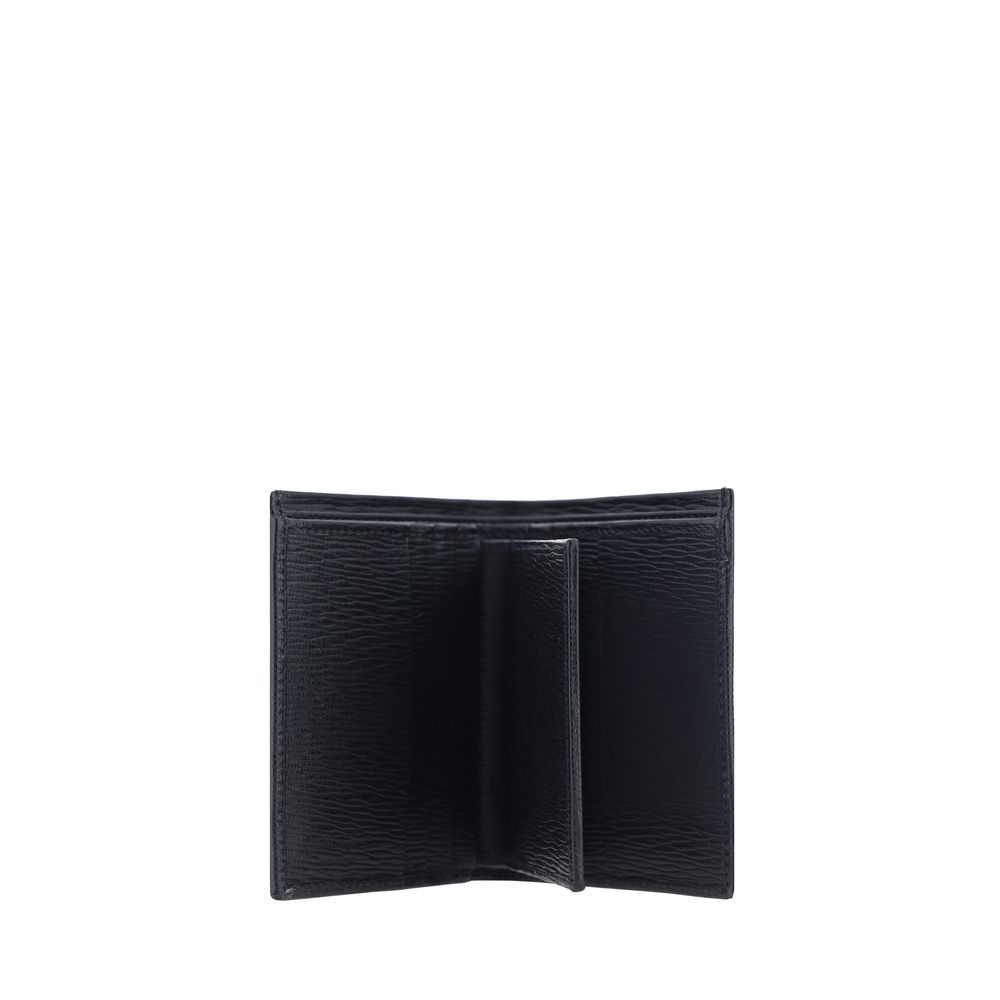 Black Calf Leather Bos Taurus WalletCalfskin Wallet by Ferragamo, billfold design, iconic Gancini logo plaque applied to front, interior card slot, bill compartment, coin pocket with flap for closure. Season: AW25 Dimension: 8x8x2 Composition: 100% Calf L