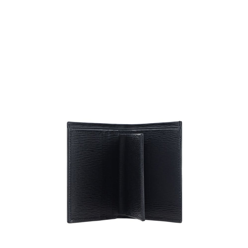 Black Calf Leather Bos Taurus WalletCalfskin Wallet by Ferragamo, billfold design, iconic Gancini logo plaque applied to front, interior card slot, bill compartment, coin pocket with flap for closure. Season: AW25 Dimension: 8x8x2 Composition: 100% Calf L