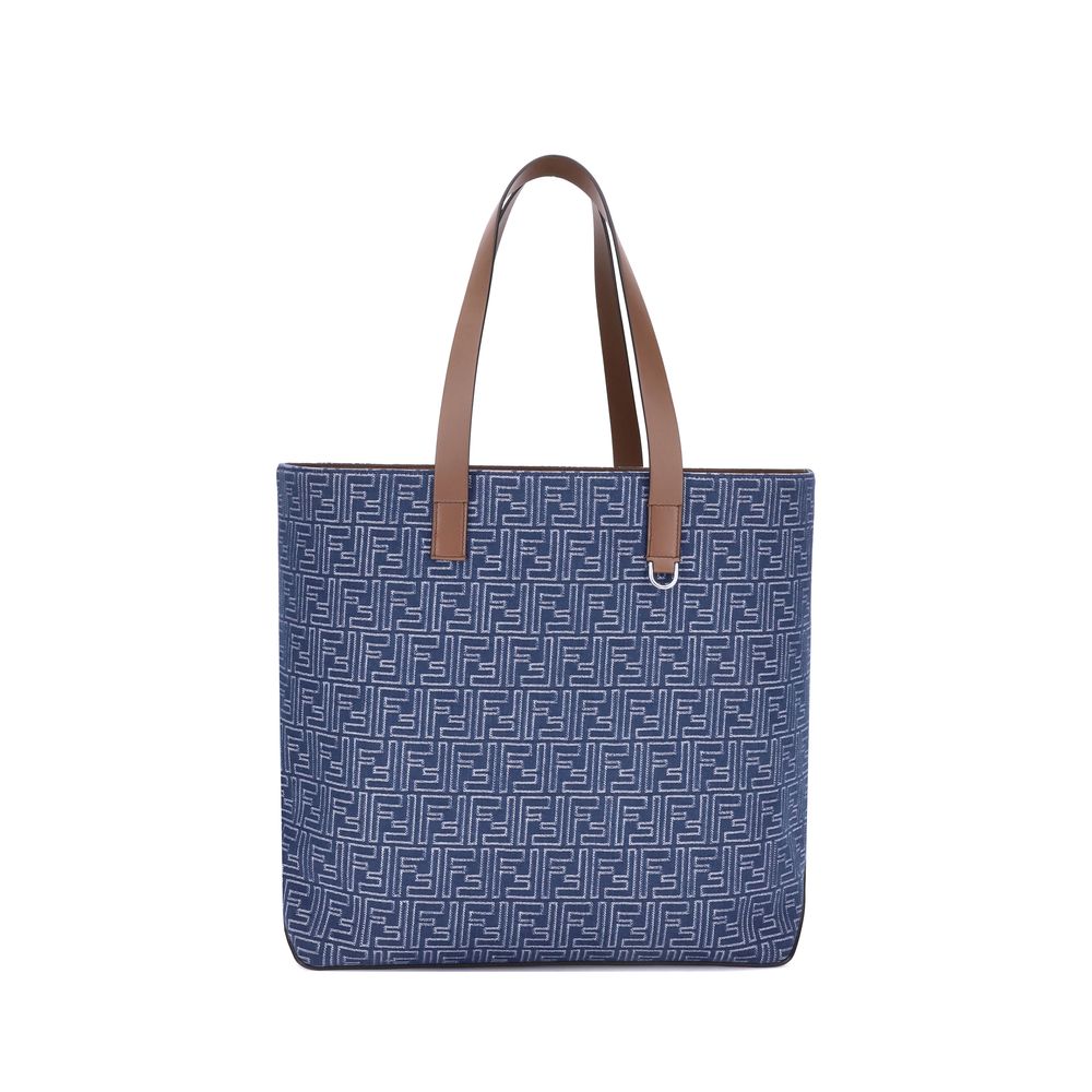 Light Blue Cotton Shoulder BagFendi’s Tote Bag combines casual style with iconic details. Made of embroidered denim with an all-over FF pattern, it is enhanced with two flat leather handles and FF metal details on the sides for a distinctive, contemporary