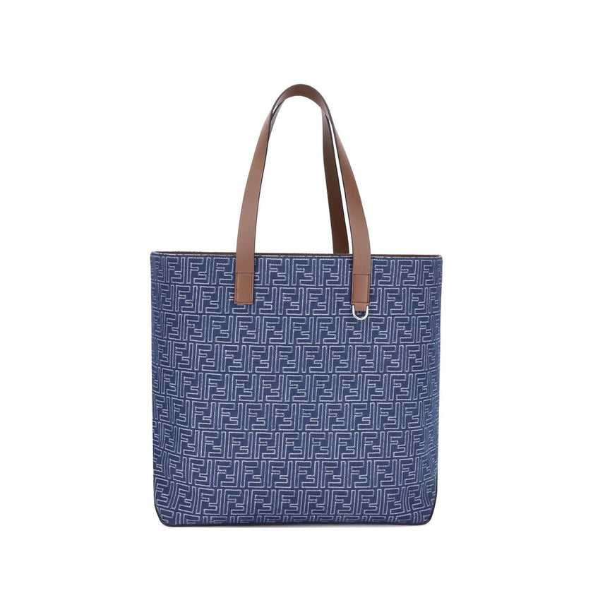 Light Blue Cotton Shoulder BagFendi’s Tote Bag combines casual style with iconic details. Made of embroidered denim with an all-over FF pattern, it is enhanced with two flat leather handles and FF metal details on the sides for a distinctive, contemporary