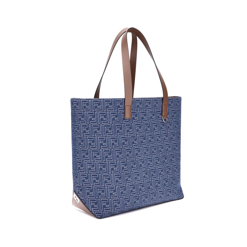 Light Blue Cotton Shoulder BagFendi’s Tote Bag combines casual style with iconic details. Made of embroidered denim with an all-over FF pattern, it is enhanced with two flat leather handles and FF metal details on the sides for a distinctive, contemporary