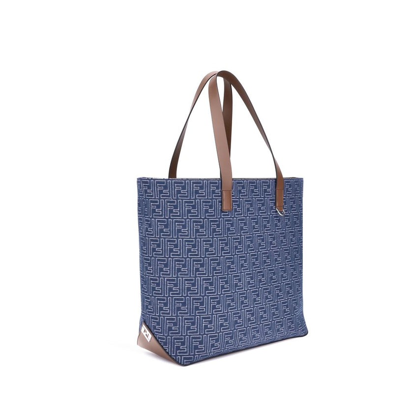 Light Blue Cotton Shoulder BagFendi’s Tote Bag combines casual style with iconic details. Made of embroidered denim with an all-over FF pattern, it is enhanced with two flat leather handles and FF metal details on the sides for a distinctive, contemporary