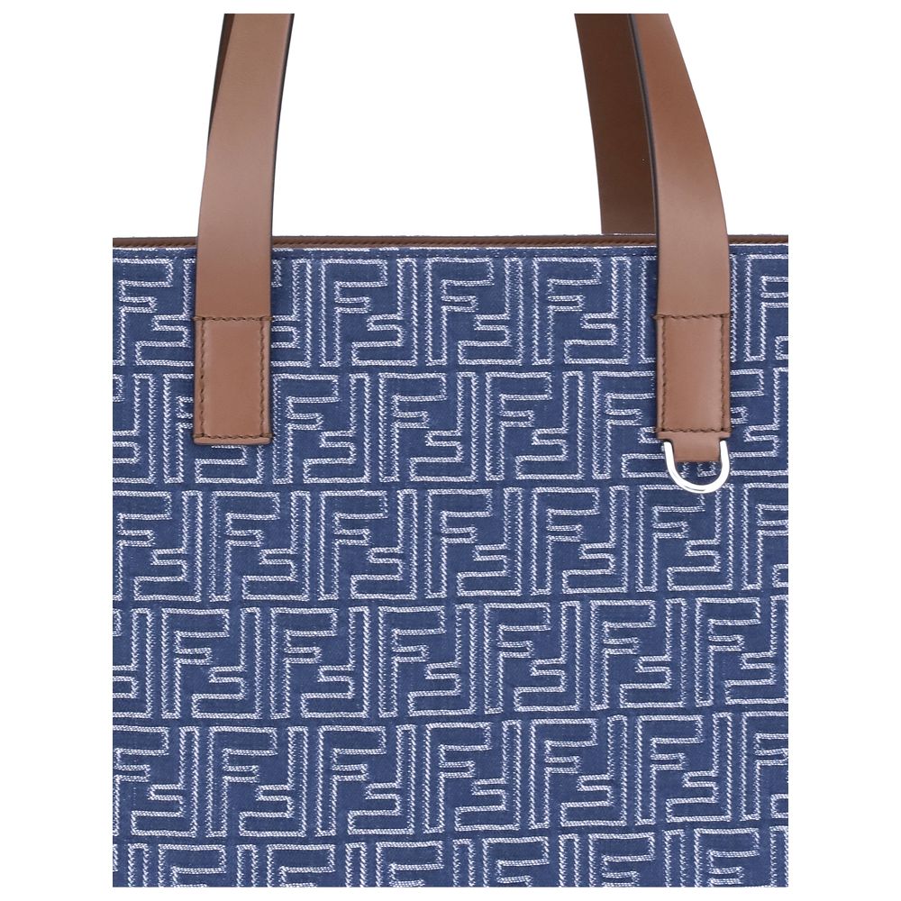 Light Blue Cotton Shoulder BagFendi’s Tote Bag combines casual style with iconic details. Made of embroidered denim with an all-over FF pattern, it is enhanced with two flat leather handles and FF metal details on the sides for a distinctive, contemporary