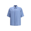 Light Blue Linen Shortsleeve ShirtFendi’s linen Shirt is an elegant and refined garment perfect for the warm season. The short-sleeved design and classic collar lend a classic touch, while the front closure with hidden buttons adds an element of discretio