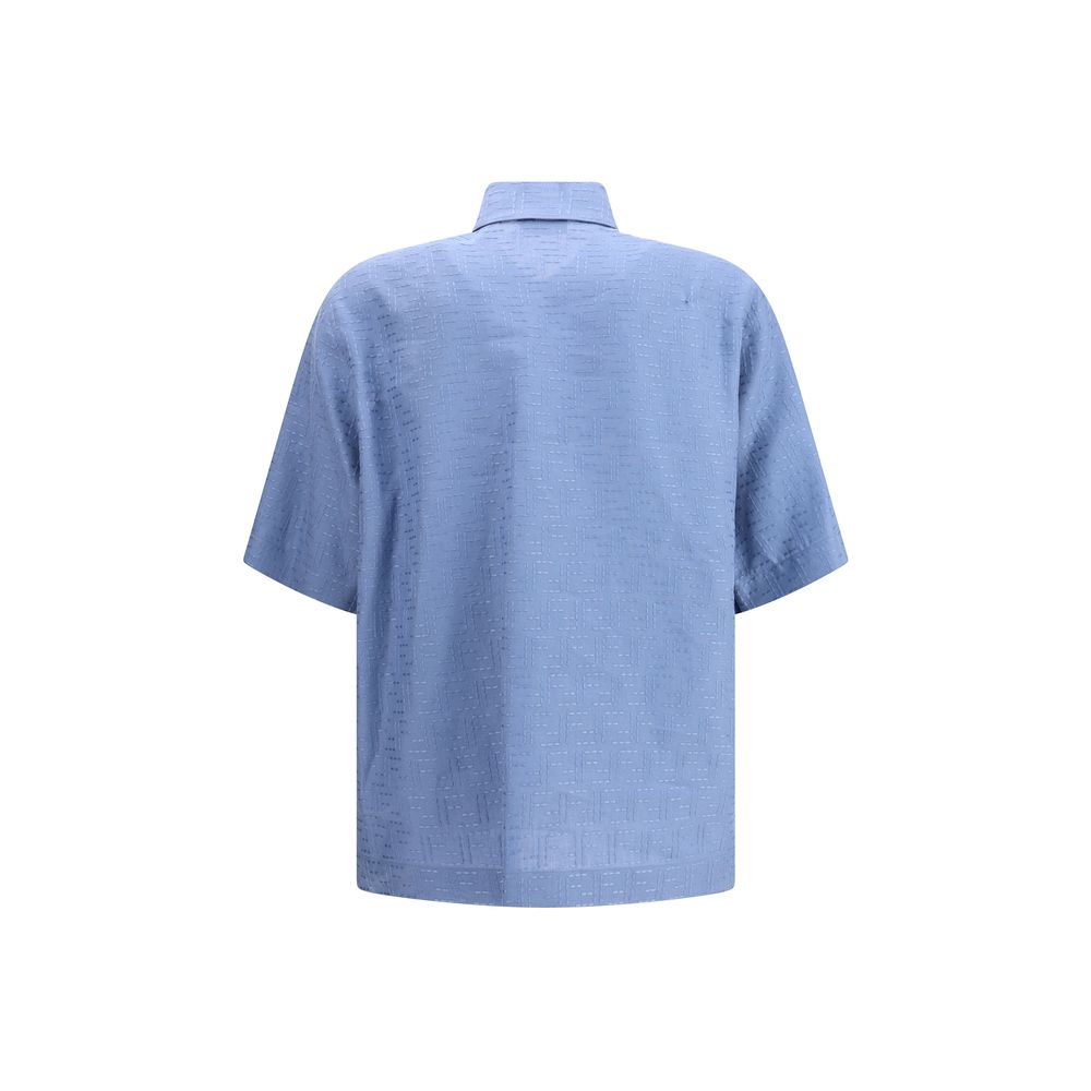 Light Blue Linen Shortsleeve ShirtFendi’s linen Shirt is an elegant and refined garment perfect for the warm season. The short-sleeved design and classic collar lend a classic touch, while the front closure with hidden buttons adds an element of discretio