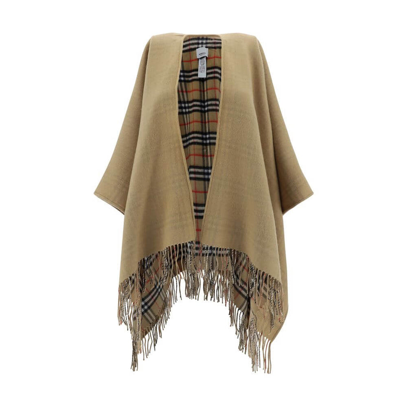 Brown Merino Wool CoatMerino Wool Cape by Burberry, monochrome cape design, shawl lapels, frayed hem, patterned Archivio Check interior, oversize fit. Season: AW25 Composition: GENERAL 100% Merino Wool MADE IN GREAT BRITAINBrown Merino Wool Coat${tagsBurb
