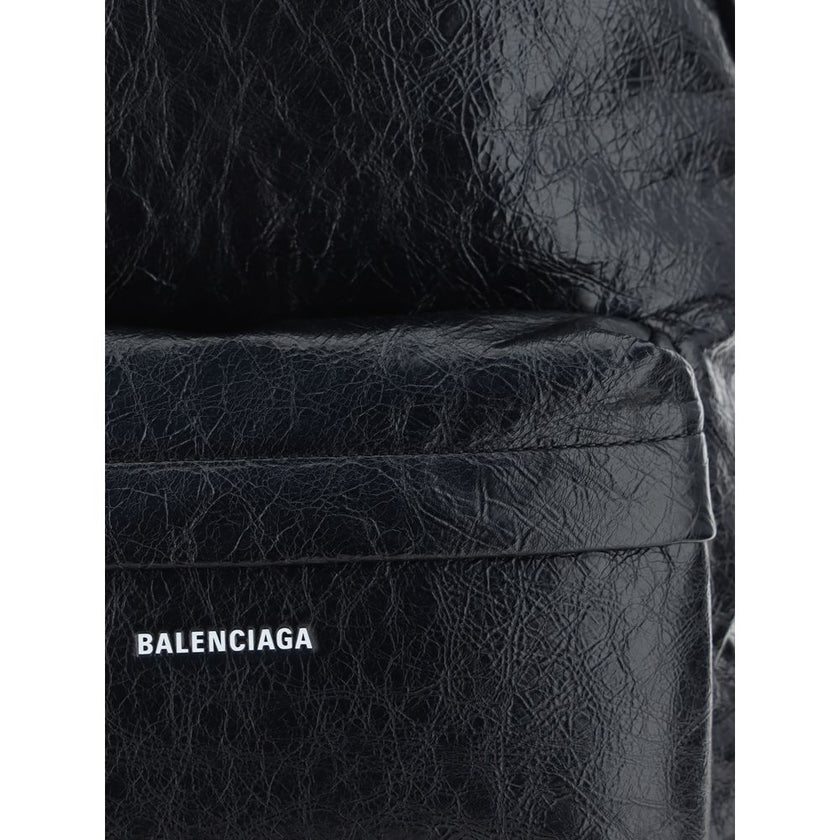 Explorer BackpackCalfskin Explorer Backpack by Balenciaga, double-slider zipper closure, contrasting printed logo on front, front patch pocket with zipper, top handle, adjustable padded shoulder straps, interior slit pocket, lined interior. Season: AW25 D