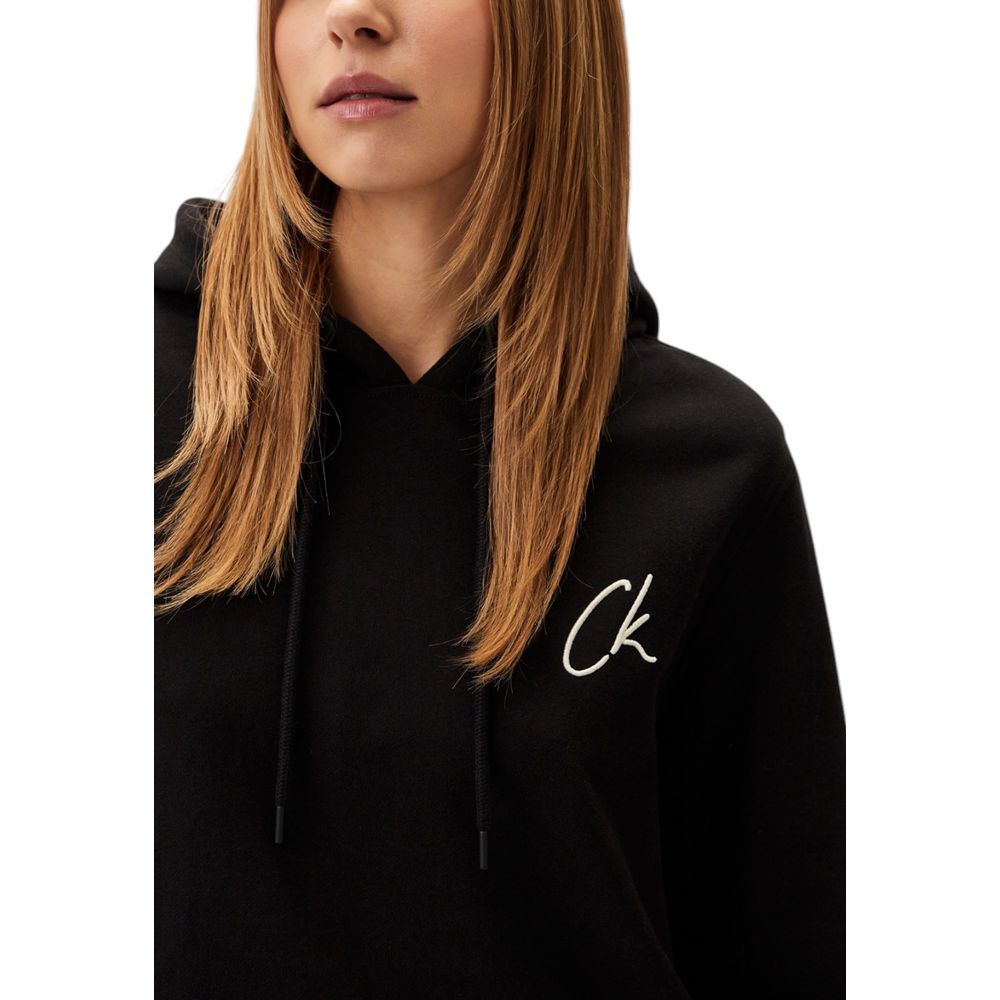 Black Recycled Cotton SweatshirtDiscover the Calvin Klein Jeans EMBROIDERED CK REGUL J20J224179 women’s sweatshirt, crafted from 100% recycled cotton. This garment combines comfort and style, making it perfect for a casual and fashionable look. The sweats