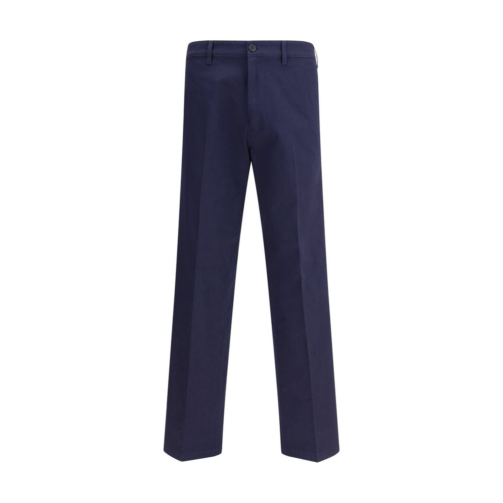 Blue Cotton Chino PantsPrada’s chino Pants offer essential elegance with contemporary style. Featuring a front zipper and button closure, they feature two side welt pockets and back pockets, one of which is embellished with the brand’s iconic logo. Waist