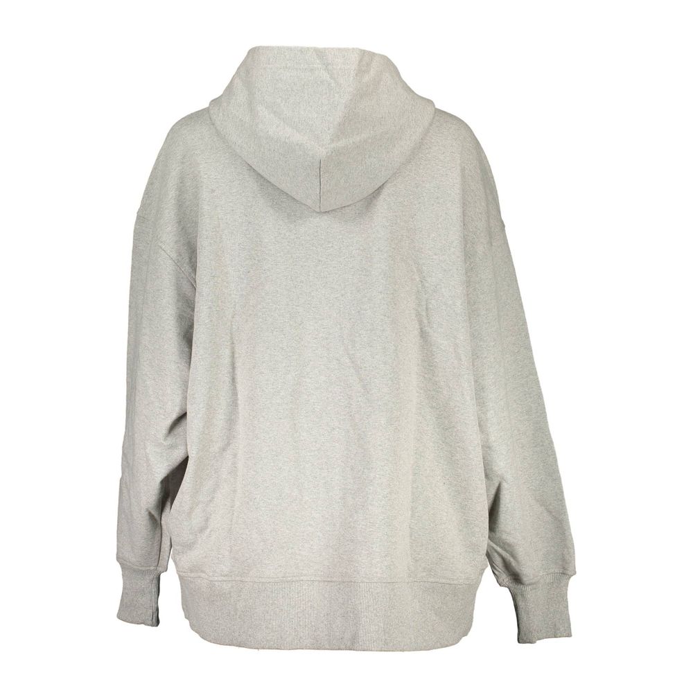 Gray Cotton Women SweaterElevate your wardrobe with the quintessential Calvin Klein hoodie, where eco-conscious fashion meets timeless comfort. Featuring an effortlessly chic long-sleeved design, this gray hooded sweatshirt comes complete with dual pocket