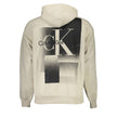Beige Cotton Men SweaterElevate your casual wardrobe with this exquisite Calvin Klein hoodie, seamlessly blending comfort and style. A classic beige tone sets the backdrop for an eye-catching print and logo, flawlessly capturing the brand’s signature soph