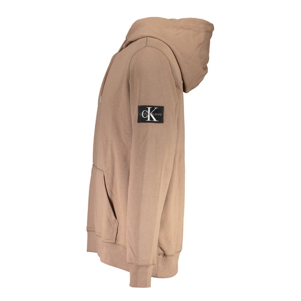 Brown Cotton Men SweaterIndulge in the epitome of contemporary sophistication with Calvin Klein’s sleek brown hoodie. This long-sleeved marvel uniquely combines comfort with style, featuring a central pocket for utility and an iconic logo that commands at