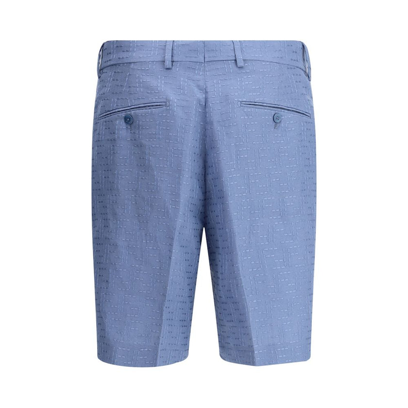 Light Blue Linen Bermuda ShortsFendi’s signature linen jacquard Shorts feature the iconic FF all-over pattern. They feature belt loops, side pockets and buttoned welt back pockets. Covered front zipper closure and small side slits at the bottom. A refined