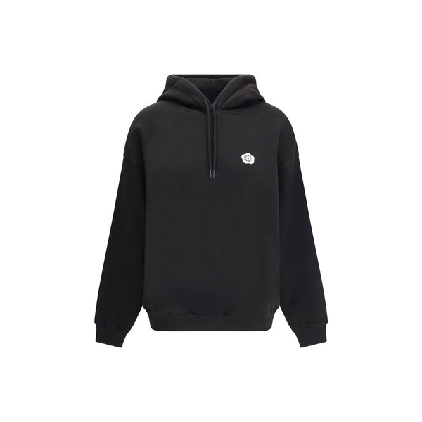 Black Cotton SweatshirtKenzo’s cotton Hoodie combines comfort and iconic style in a relaxed, contemporary design. Made of soft cotton that is internally plush, it features an adjustable drawstring hood and ribbed cuffs and hem for a structured finish. The