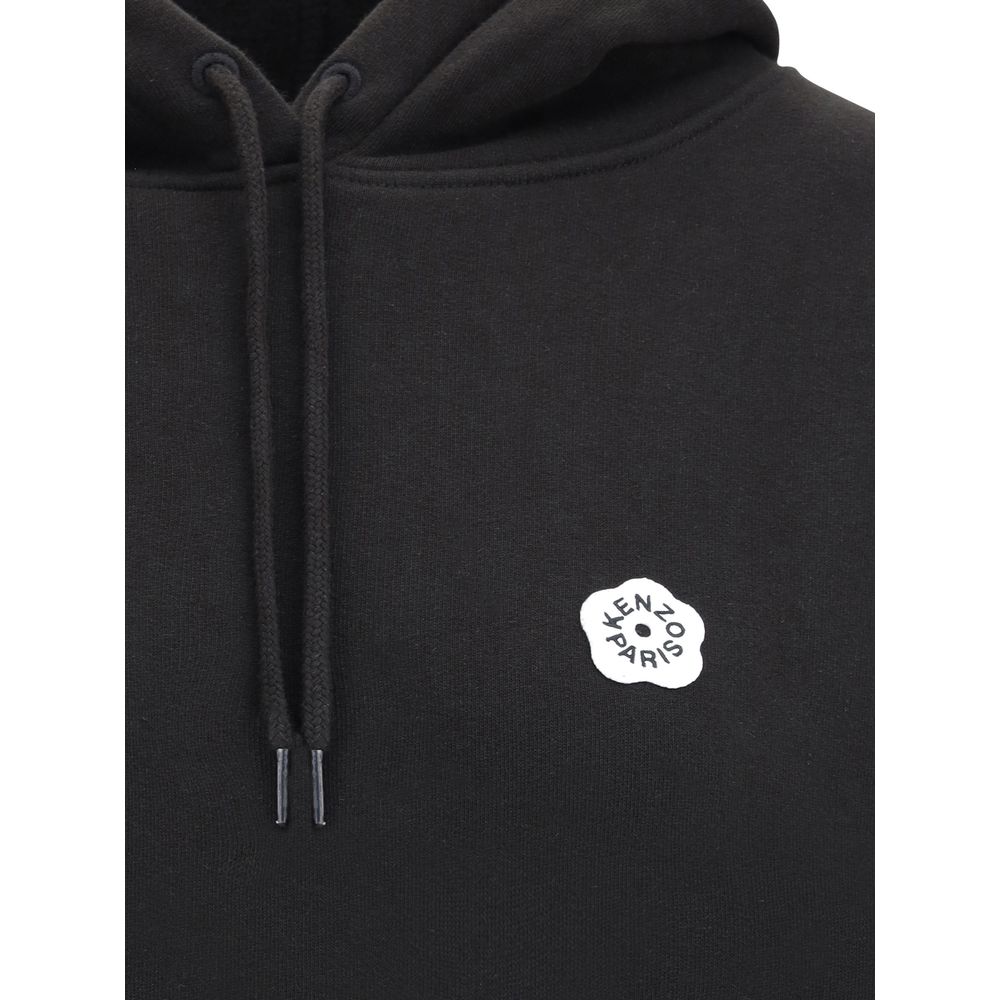 Black Cotton SweatshirtKenzo’s cotton Hoodie combines comfort and iconic style in a relaxed, contemporary design. Made of soft cotton that is internally plush, it features an adjustable drawstring hood and ribbed cuffs and hem for a structured finish. The