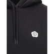 Black Cotton SweatshirtKenzo’s cotton Hoodie combines comfort and iconic style in a relaxed, contemporary design. Made of soft cotton that is internally plush, it features an adjustable drawstring hood and ribbed cuffs and hem for a structured finish. The