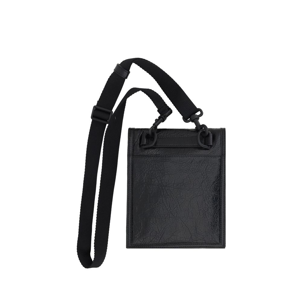 Black Calf Leather Bos Taurus Shoulder BagBalenciaga’s Explorer Shoulder Bag is a modern and versatile accessory made of grained leather that gives a sleek and durable texture. The front flap closure ensures security and practicality, while the front zipp