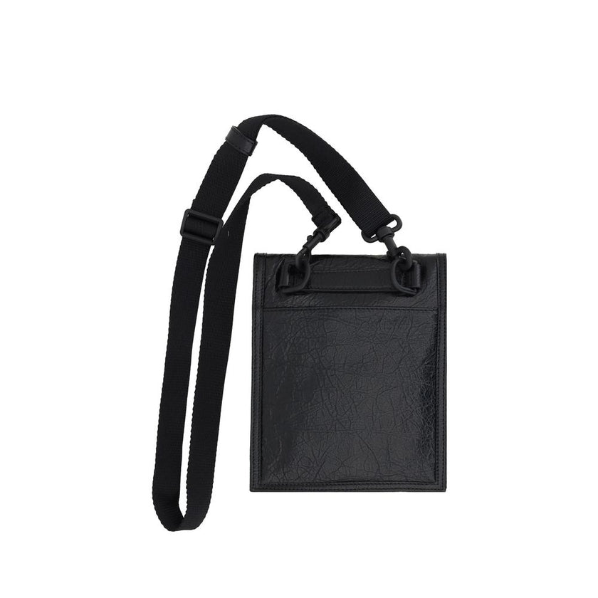 Black Calf Leather Bos Taurus Shoulder BagBalenciaga’s Explorer Shoulder Bag is a modern and versatile accessory made of grained leather that gives a sleek and durable texture. The front flap closure ensures security and practicality, while the front zipp