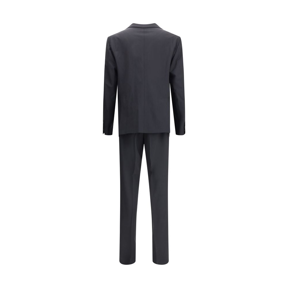 Black Fleece Wool Two-Piece SuitDsquared2 Virgin Wool London Suit, consisting of jacket and pants. Wool blazer jacket, front button closure, three welt pockets on the front with flap, one slit pocket on the front, peaked lapels. Classic wool pants, front