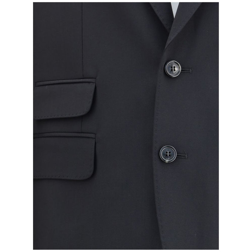 Black Fleece Wool Two-Piece SuitDsquared2 Virgin Wool London Suit, consisting of jacket and pants. Wool blazer jacket, front button closure, three welt pockets on the front with flap, one slit pocket on the front, peaked lapels. Classic wool pants, front