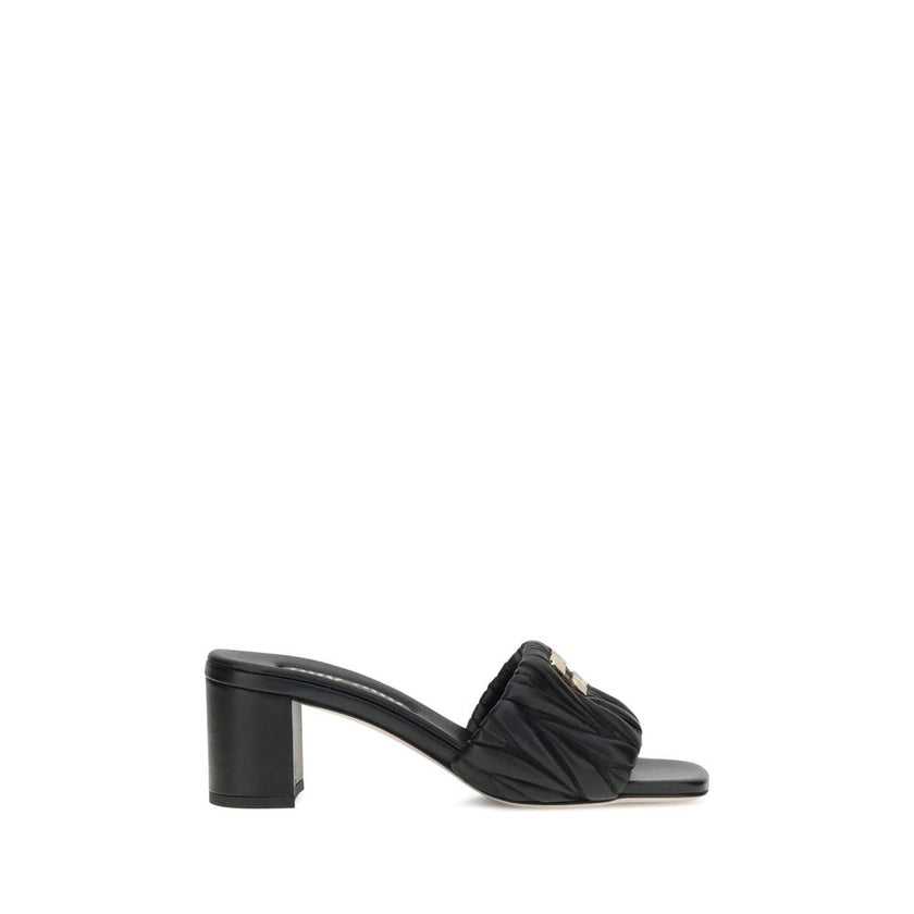 Black Lamb Ovis Aries Aries Stiletto Heel SandalsMiu Miu’s lambskin Sandals combine elegance and comfort in a sophisticated design. With a squared toe and padded straps, they are embellished with a metal plaque featuring the iconic Miu Miu monogram on the