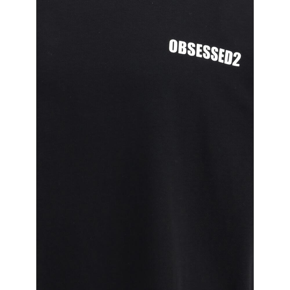 Black Cotton T-ShirtDsquared2’s T-Shirt is a casual piece with a strong character, made from cotton and finished with a classic ribbed crew neck. The contrasting Obsessed2 print stands out on the front and the iconic signature on the back adds a graphic a