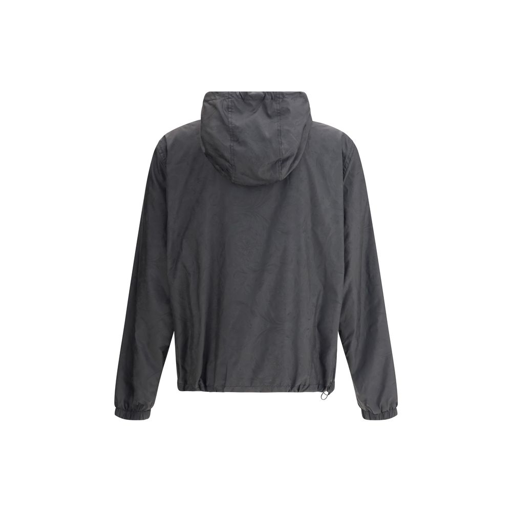 Black Polyester Shell JacketWaterproof Jacket by Versace with a functional and sophisticated design. The design features an adjustable drawstring hood, front zipper closure and two side welt pockets. Elasticized cuffs and an adjustable drawstring hem ensu