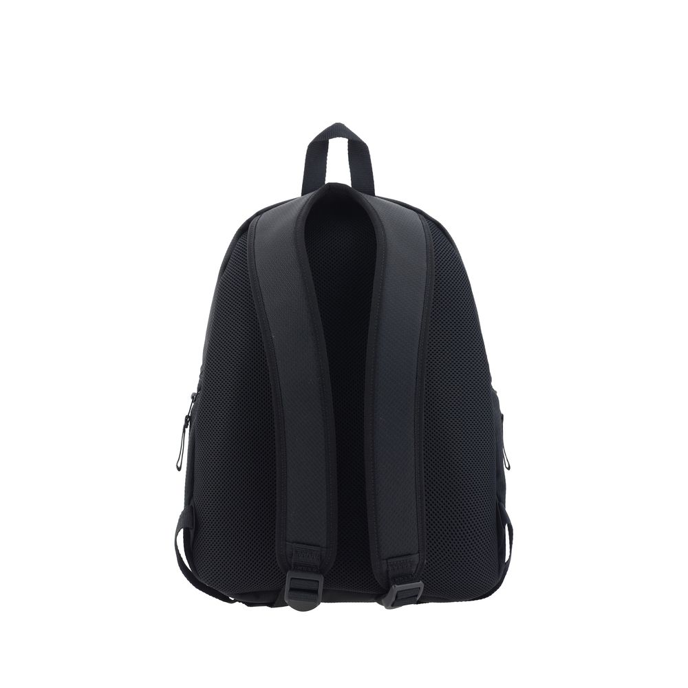 Black Polyamide BackpackUnity Backpack by Balenciaga, top handle, adjustable shoulder straps, front flap and buckle closure, two zippered pockets for closure on side panels, iconic contrasting brand monogram on front flap, zippered slit pocket on flap. Se