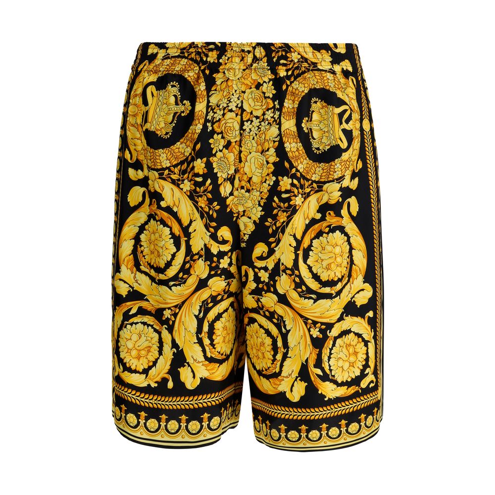 Multicolor Silk Bermuda ShortsSilk Shorts by Versace featuring the brand’s iconic baroque pattern. The model features an elasticized waistband for a comfortable and flexible fit, two side slash pockets and a welt pocket on the back. A lightweight and refi
