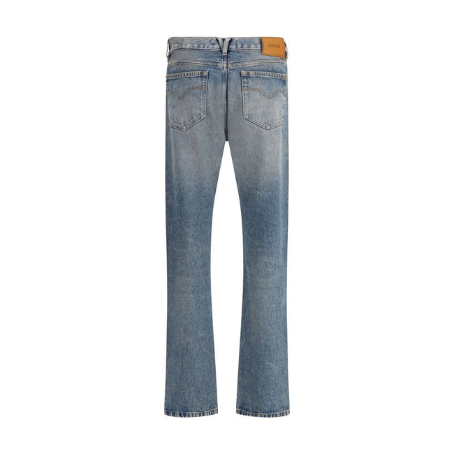 Blue Cotton Straight-Leg JeansVersace’s cotton Jeans combine classic design with the Maison’s iconic codes. They feature a front zipper and button closure, belt loops at the waist and a traditional five-pocket pattern. On the front, a metallic detail with