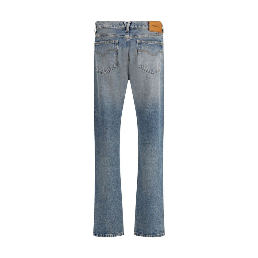 Blue Cotton Straight-Leg JeansVersace’s cotton Jeans combine classic design with the Maison’s iconic codes. They feature a front zipper and button closure, belt loops at the waist and a traditional five-pocket pattern. On the front, a metallic detail with