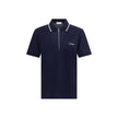 Blue Cotton Polo ShirtCotton polo shirt by Ferragamo has a refined and contemporary design. The classic collar is defined by a contrasting profile, while the zipper front closure adds a modern touch. The iconic Ferragamo monogram, embroidered in contrast