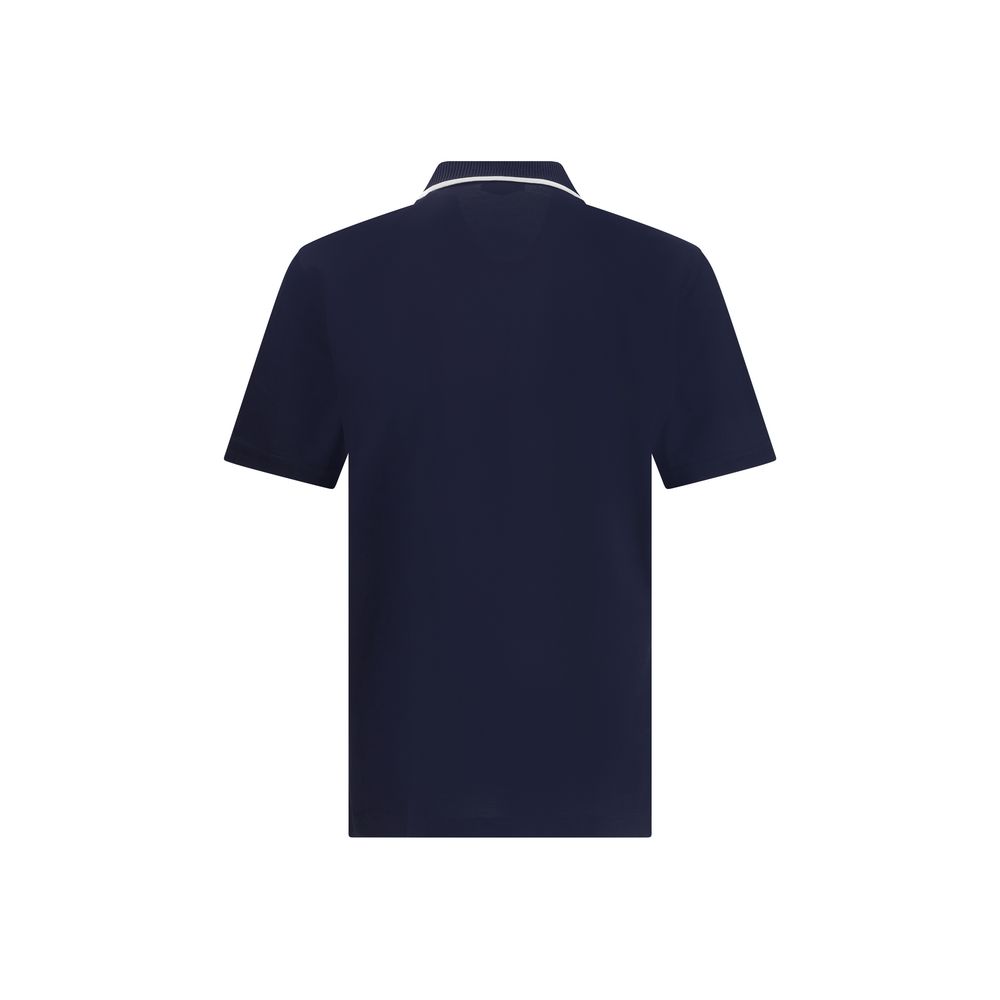 Blue Cotton Polo ShirtCotton polo shirt by Ferragamo has a refined and contemporary design. The classic collar is defined by a contrasting profile, while the zipper front closure adds a modern touch. The iconic Ferragamo monogram, embroidered in contrast