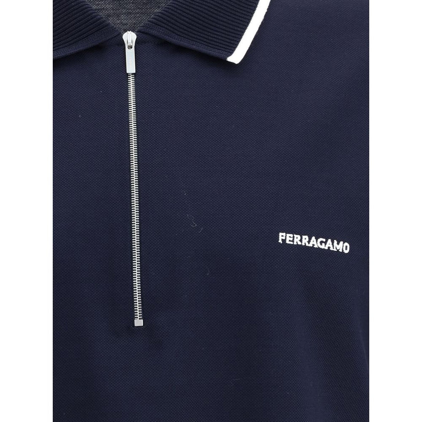 Blue Cotton Polo ShirtCotton polo shirt by Ferragamo has a refined and contemporary design. The classic collar is defined by a contrasting profile, while the zipper front closure adds a modern touch. The iconic Ferragamo monogram, embroidered in contrast