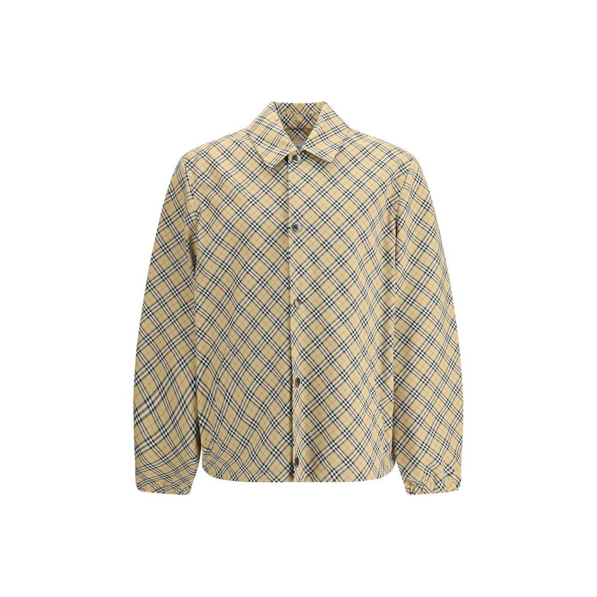 Beige Polyester Jackets And CoatBurberry’s signature shirt-cut jacket is crafted with an essential and contemporary design. The design features a classic collar, front snap button closure and elastic cuffs for a comfortable and functional fit. The adjusta