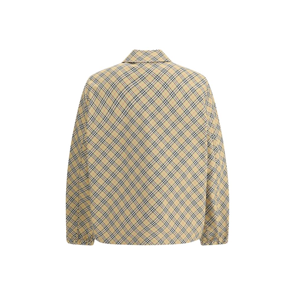 Beige Polyester Jackets And CoatBurberry’s signature shirt-cut jacket is crafted with an essential and contemporary design. The design features a classic collar, front snap button closure and elastic cuffs for a comfortable and functional fit. The adjusta