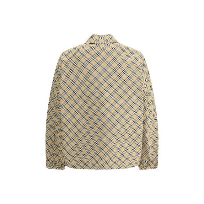 Beige Polyester Jackets And CoatBurberry’s signature shirt-cut jacket is crafted with an essential and contemporary design. The design features a classic collar, front snap button closure and elastic cuffs for a comfortable and functional fit. The adjusta