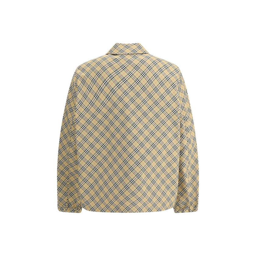 Beige Polyester Jackets And CoatBurberry’s signature shirt-cut jacket is crafted with an essential and contemporary design. The design features a classic collar, front snap button closure and elastic cuffs for a comfortable and functional fit. The adjusta